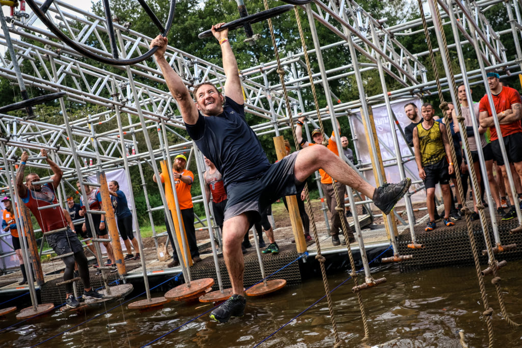 obstacle swinging man