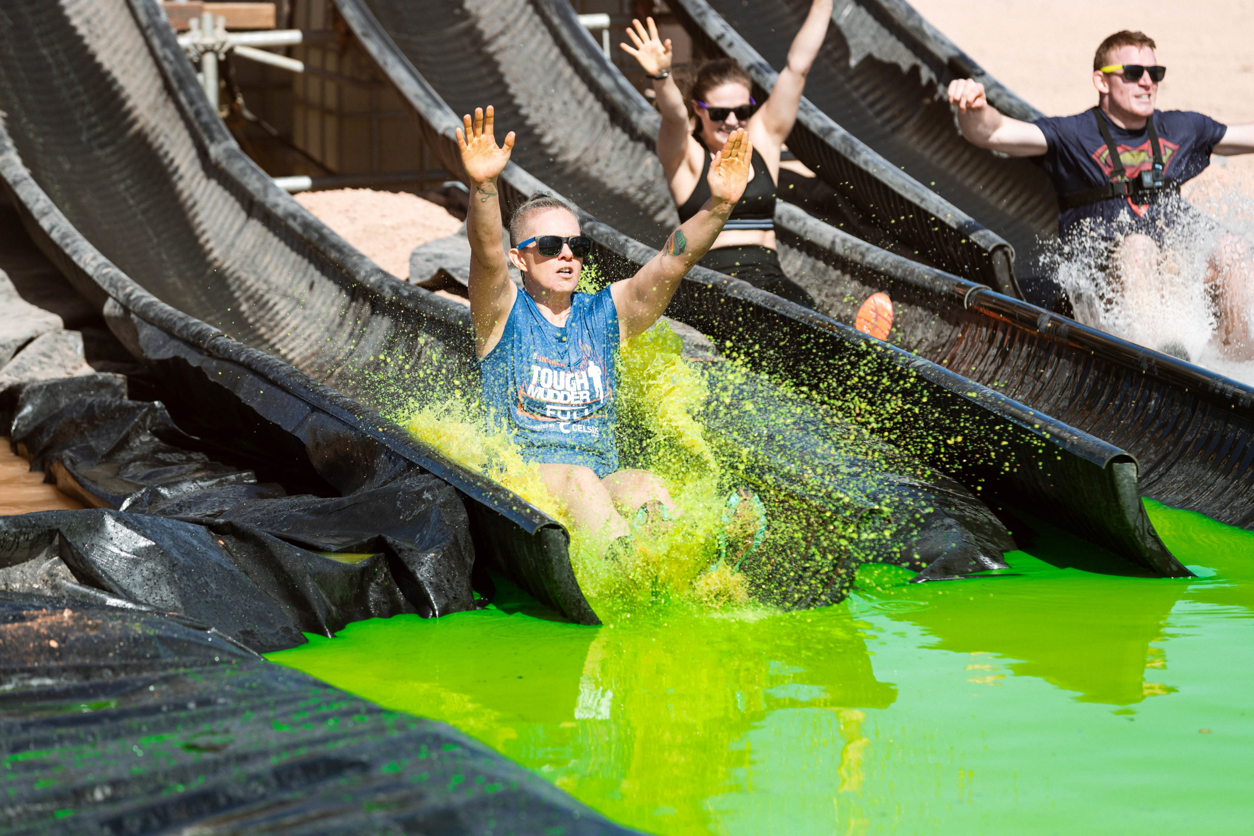 Participant sliding to the green water