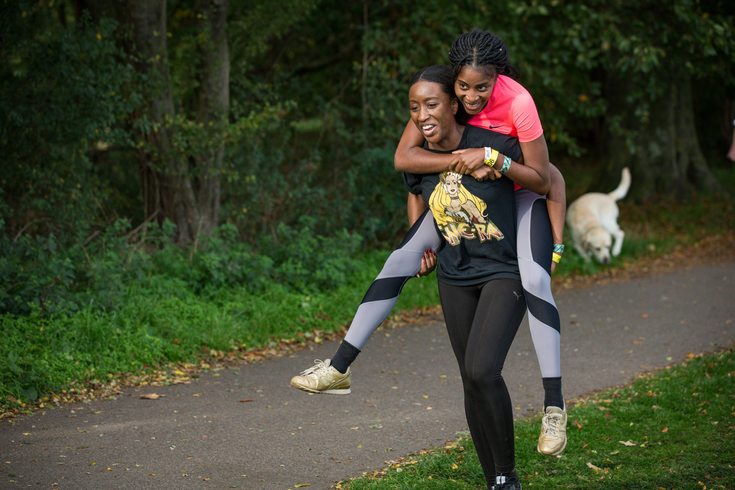 Participant carrying her partner in her back