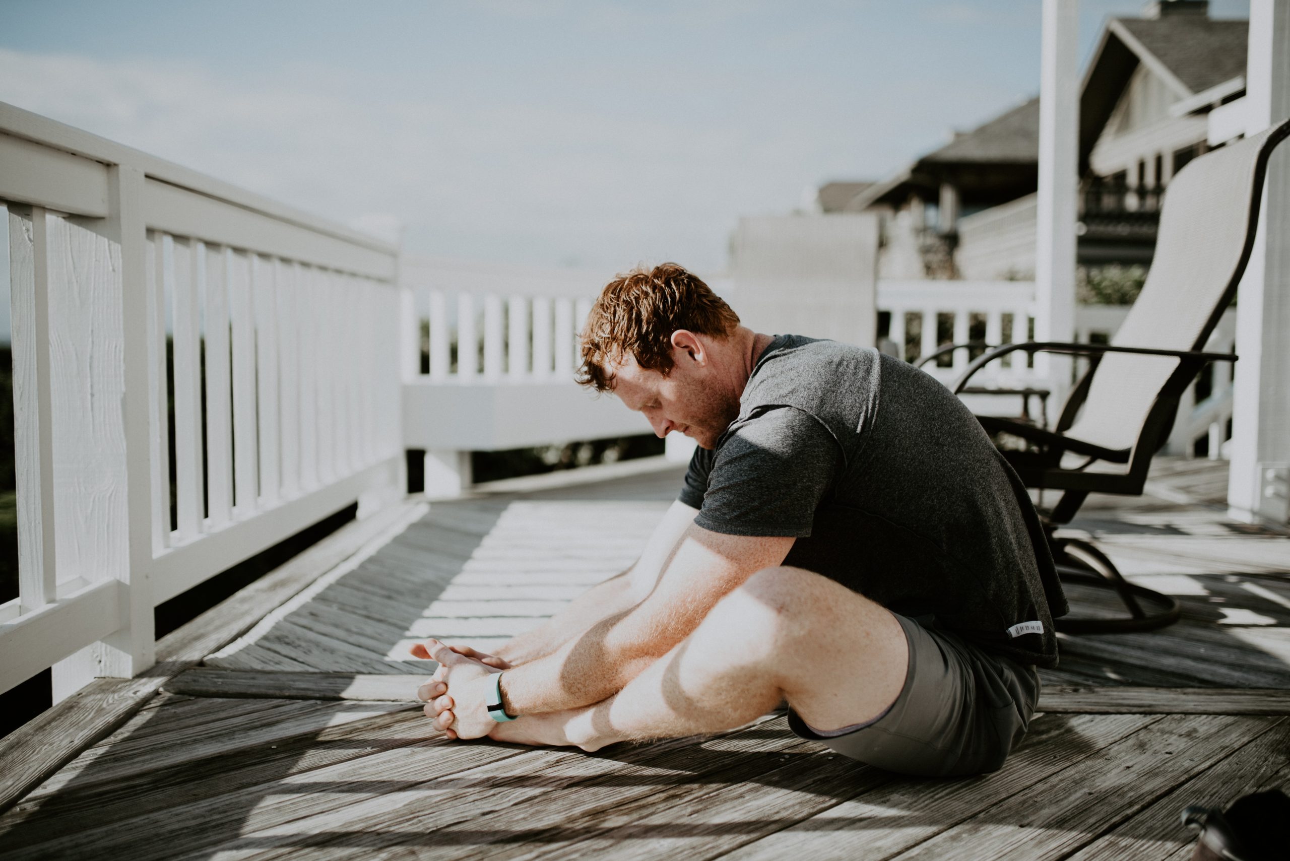 Man stretching outside