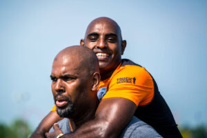 Participant carrying his partner in the back