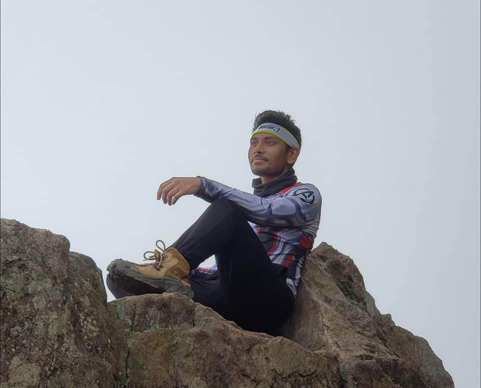 A man at the edge of a mountain