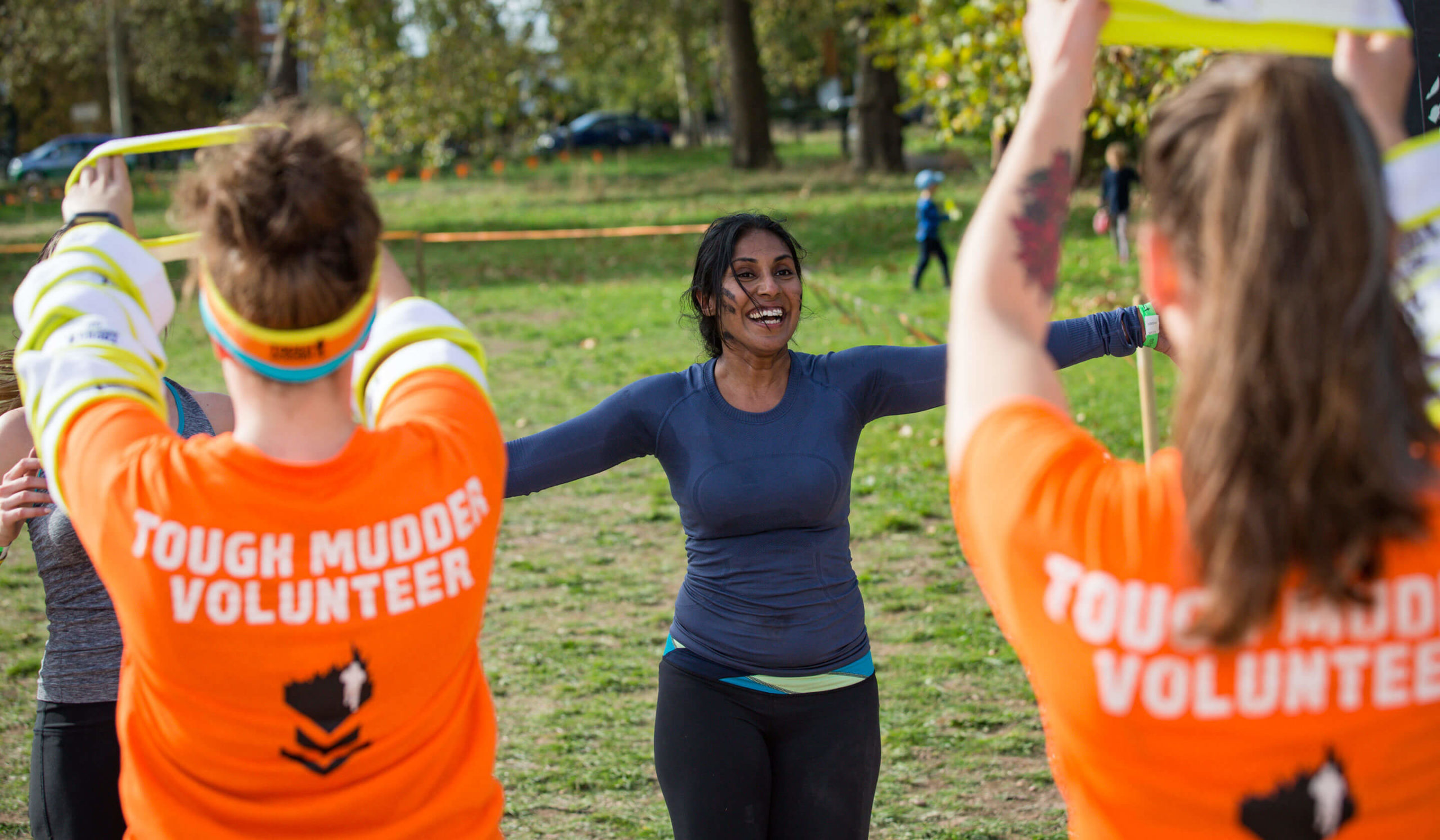 Volunteer and participants doing warmup exercise