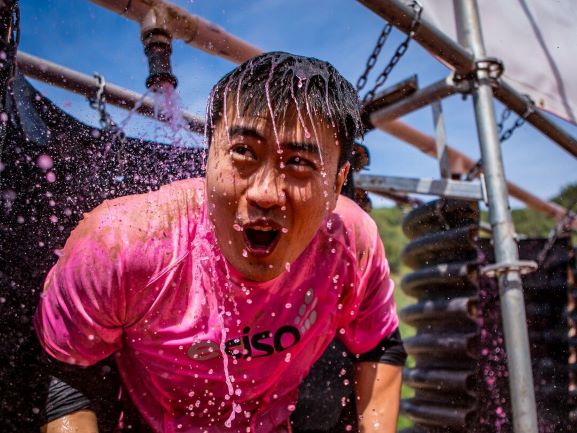 Participant wearing pink shirt catching his breath