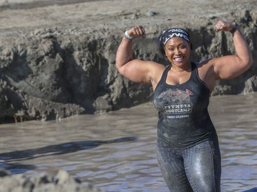 A woman flexing her arm muscles