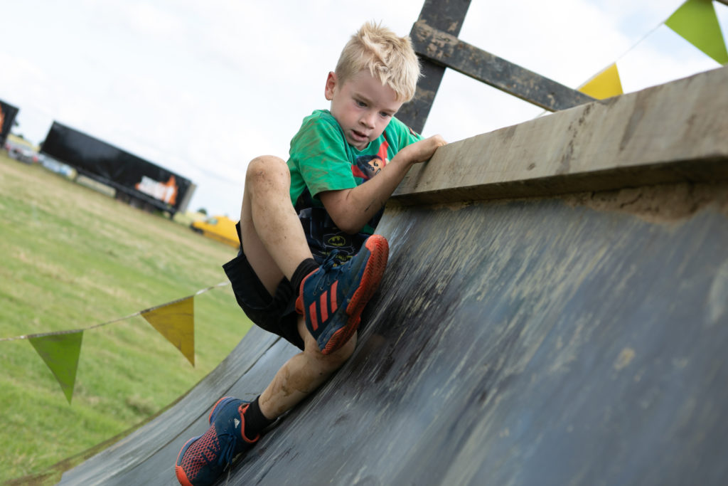 kid climbing obstacle