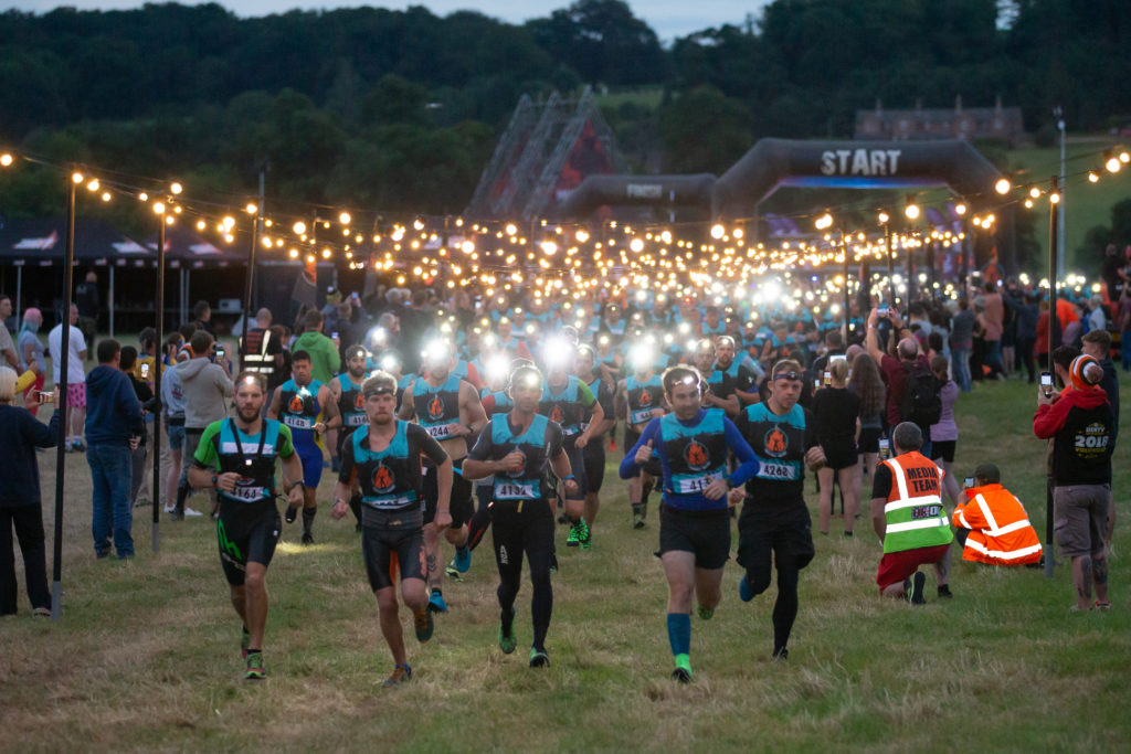 big group of runners at night 