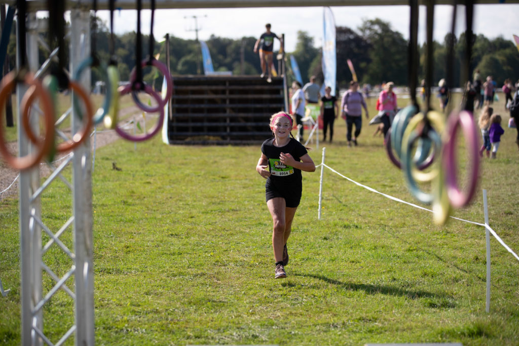 little girl running towards obstacle