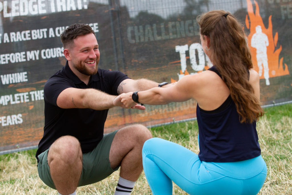 girl boy squat hold 