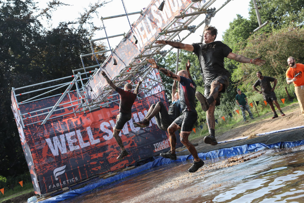 guys on swinging obstacle