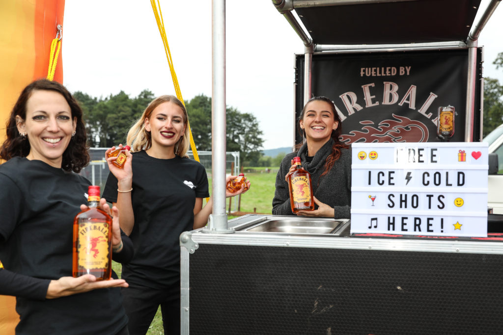 three people fireball stand