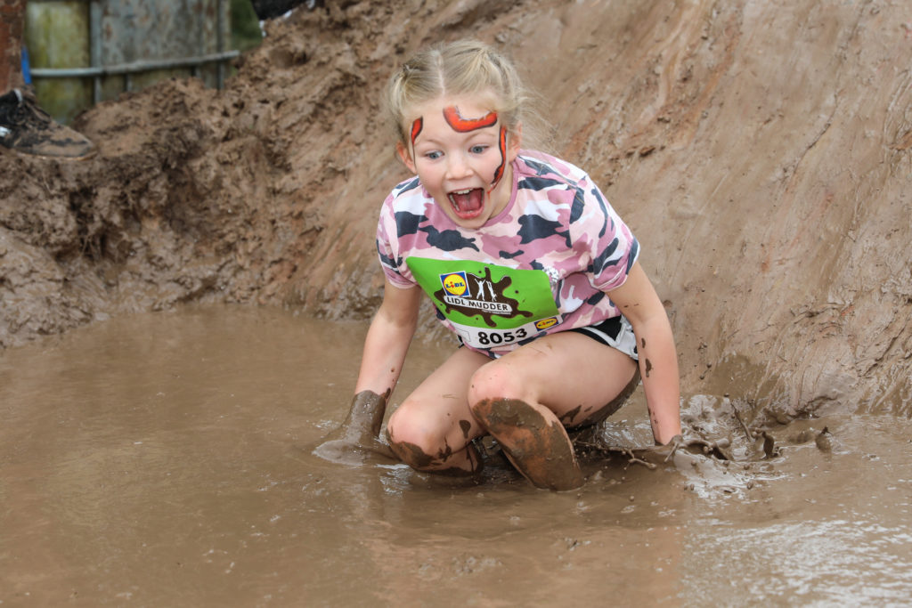 little girl muddy water