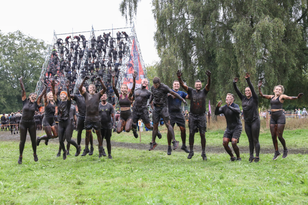 muddy team jumping