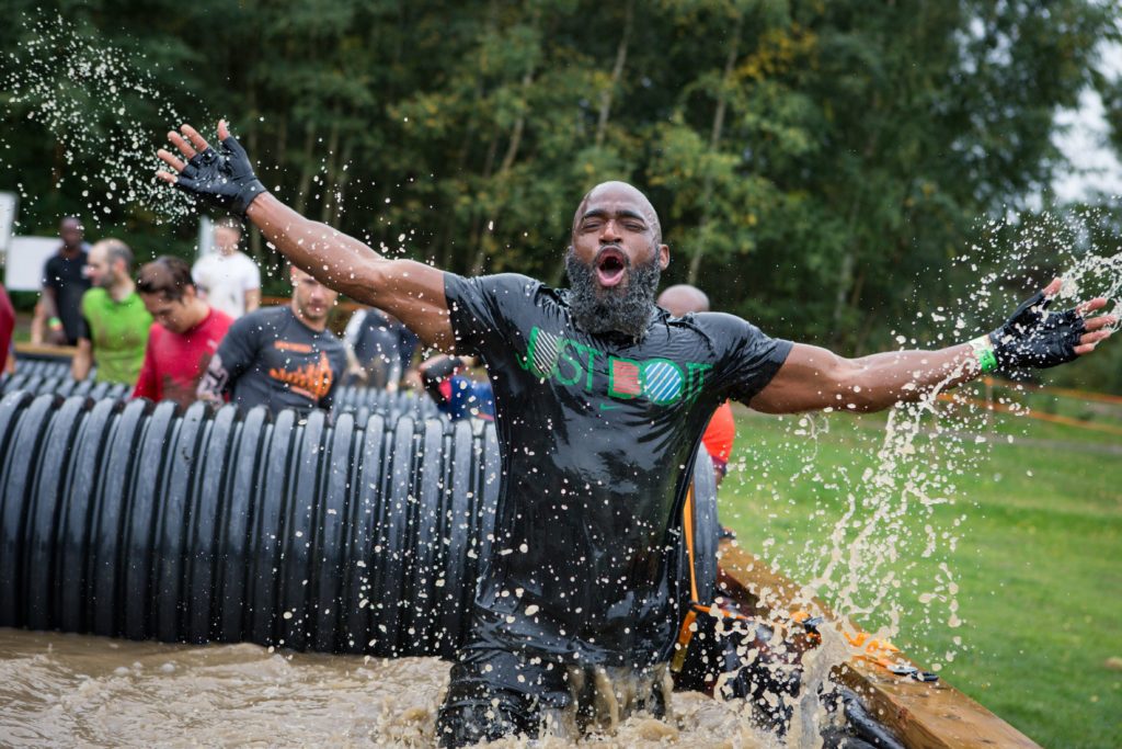 Participant catch his breath with arms open wide