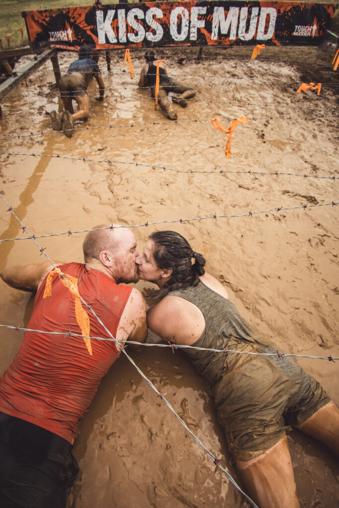 couple in mud adventure