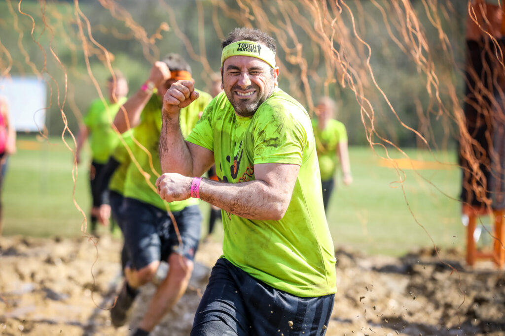 man running through obstacle
