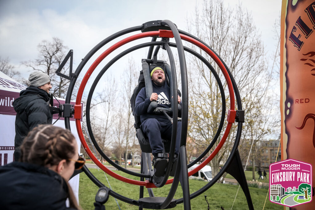 man in anti-gravity chair at event