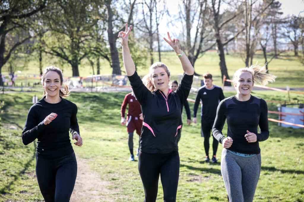 three friends running and cheering