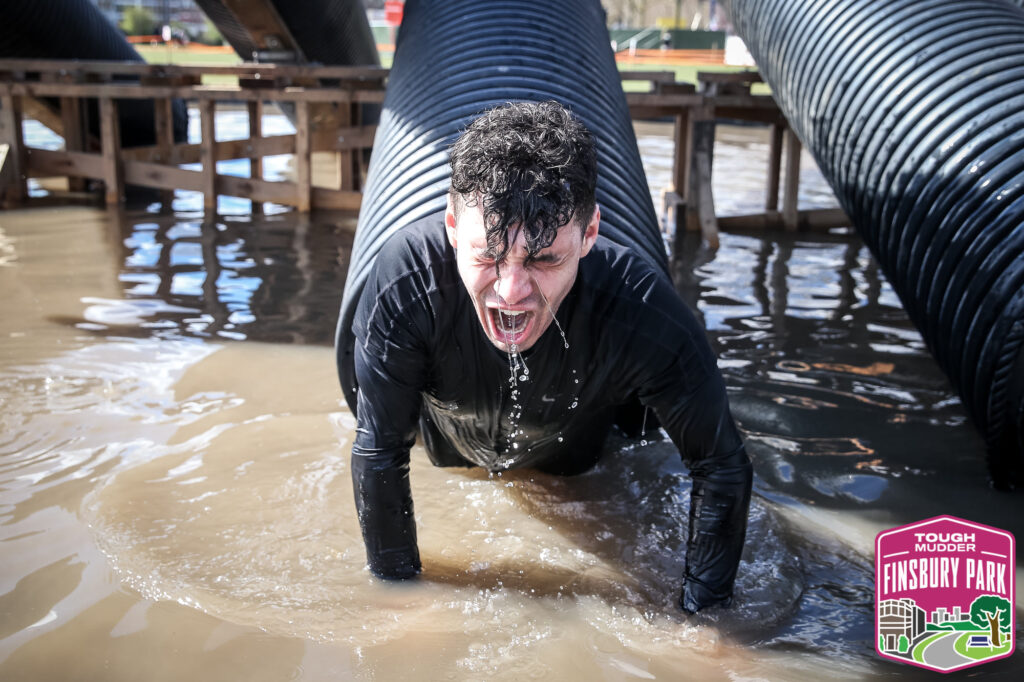 man eyes closed in water obstacle