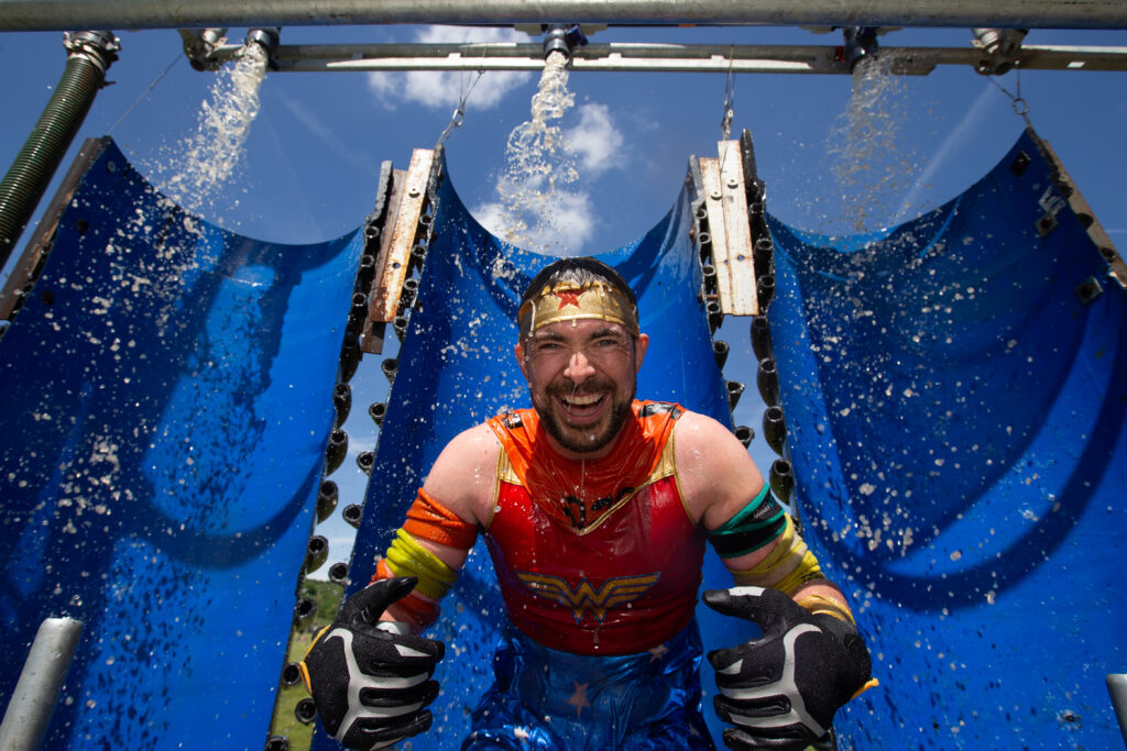 smiling man on obstacle at London West event