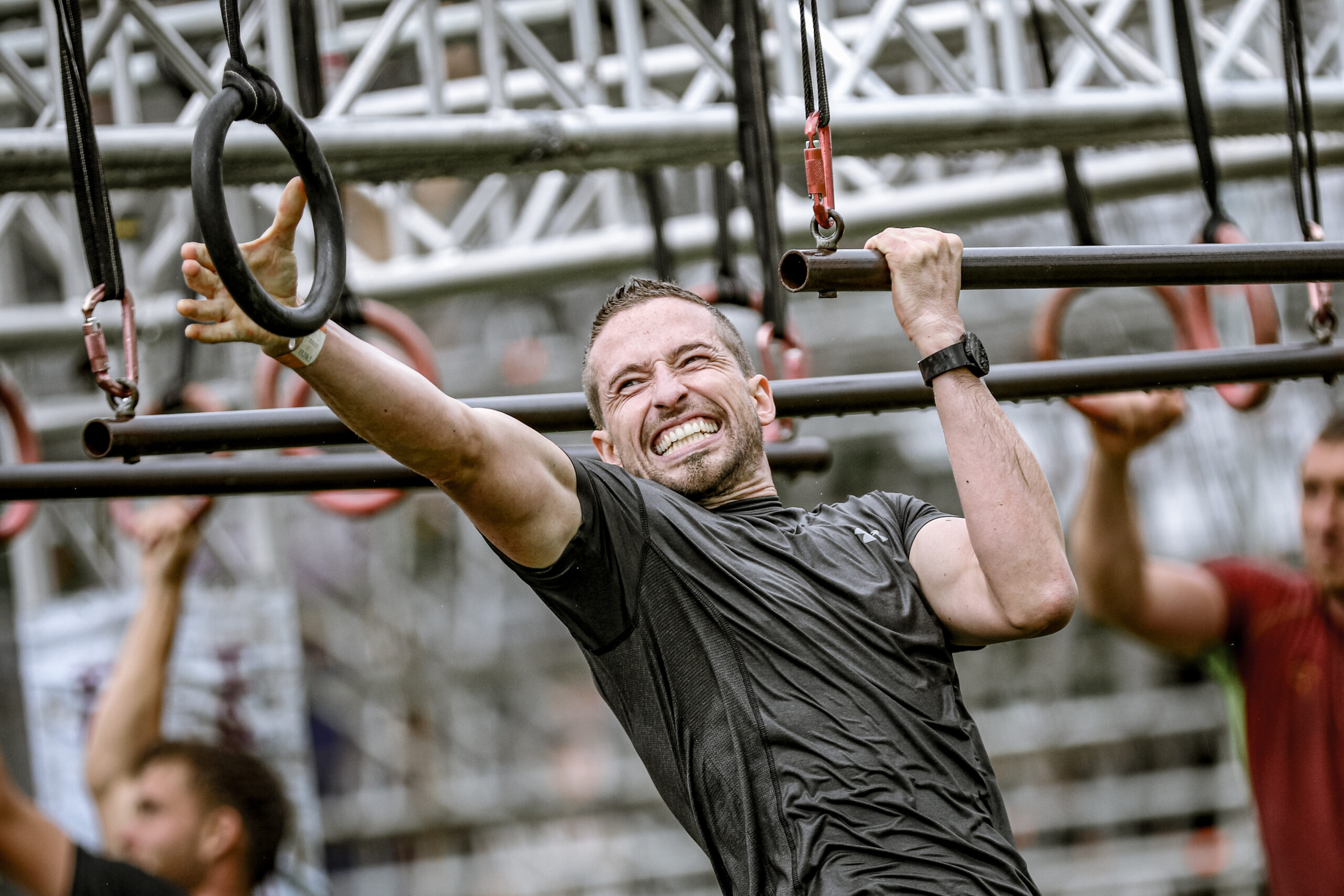 A participant smiling as he goes through Funky Monkey