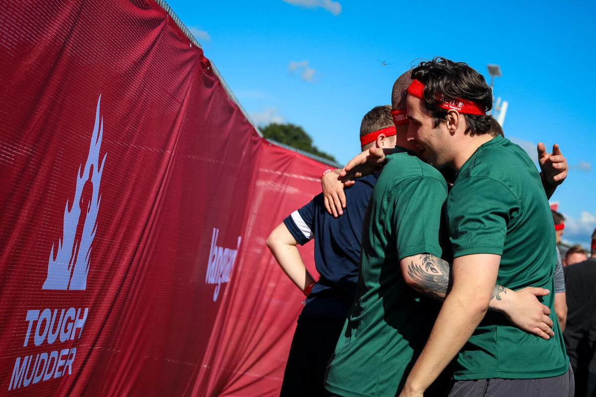 Participants hugging each other