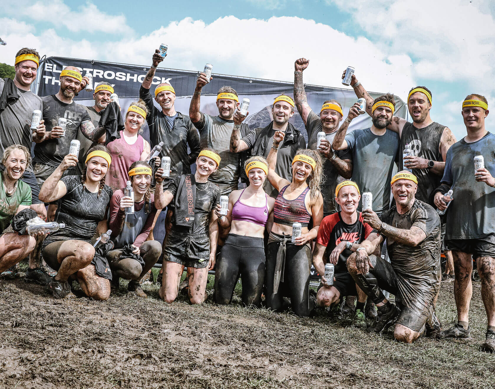 Participants posing for a picture with beers in their hands