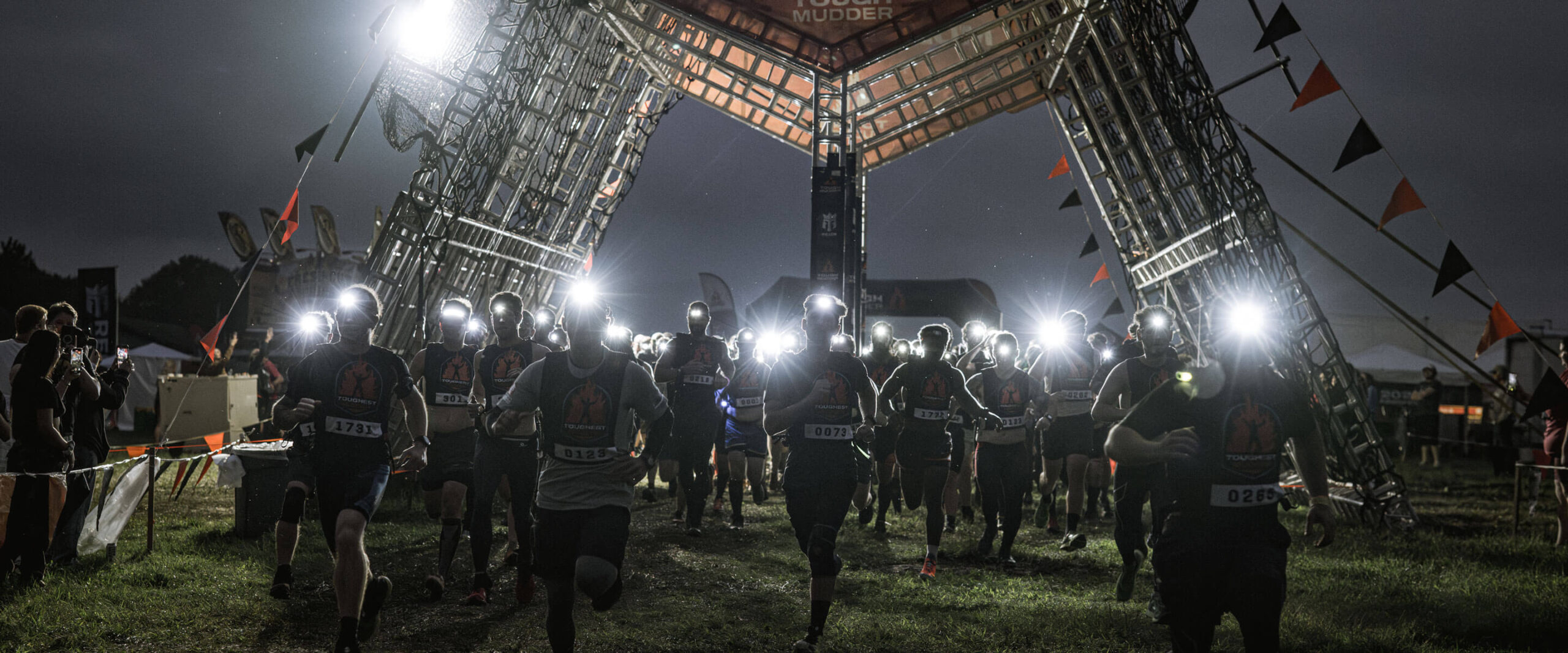 Participants running in the dark with flashlights on their head