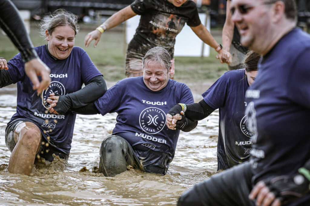 Participants walking on the water mud