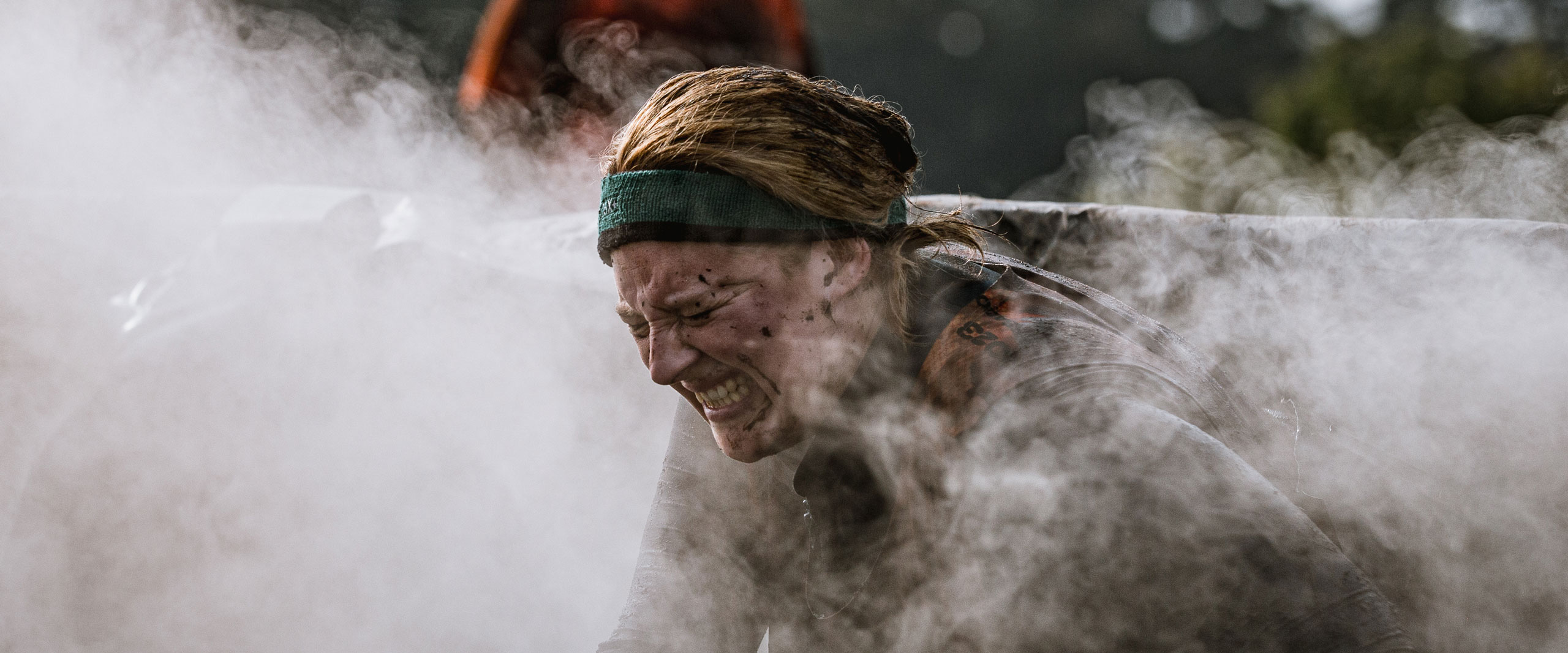 A participant closing her eyes to avoid the smoke of Cry Baby